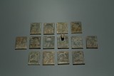 A SET OF FOURTEEN JADE PLAQUES