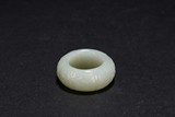 A WHITE JADE CARVED RING