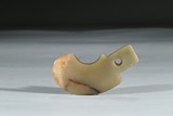 A CELADON 'AXE' FORM PENDANT