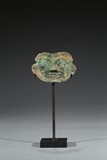 AN ARCHAIC BRONZE MYTHICAL MASK