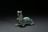 A PATINATED BRONZE FIGURE OF QILIN 