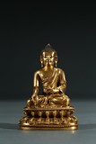 A CHINESE GILT BRONZE FIGURE OF SHAKYAMUNI