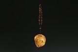 A NATURALISTIC TIANHUANG CARVED PENDANT