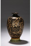 A CARVED DARK BROWN GLAZED VASE 