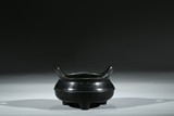 A BRONZE TRIPOD CENSER