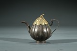 A SILVER MELON-FORMED TEAPOT WITH COVER 