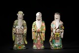 A SET OF THREE FAMILLE ROSE FU LU SHOU FIGURES
