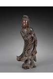A CHINESE HARDWOOD GUANYIN CARVING