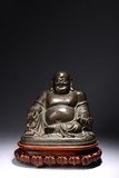 A CHINESE BRONZE FIGURE OF SEATED BUDAI 