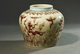 AN UNDERGLAZE RED 'MYTHICAL BEASTS' JAR