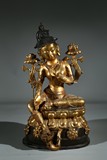 A GILT BRONZE FIGURE OF GREEN TARA
