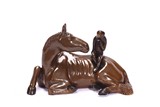 A BROWN GLAZED MODEL OF MONKEY AND HORSE
