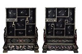 A PAIR OF GILT-PAINTED BLACK LACQUER TABLE SCREEN CABINETS