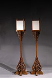 A PAIR OF YUMU CANDLE STANDS