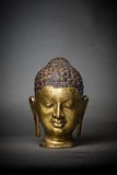 A GILT BRONZE BUDDHA HEAD