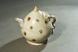 A WHITE GLAZED PEACH-FORM WATERPOT