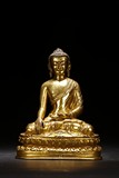 A GILT BRONZE FIGURE OF SEATED SHAKYAMUNI