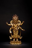 A GILT BRONZE FIGURE OF STANDING MAHAKALA