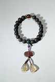AN AGARWOOD BEAD BRACELET