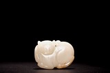 A CHINESE WHITE JADE 'TIGER CUB' PENDANT