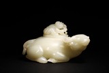 A CHINESE WHITE JADE 'BOY AND BUFFALO' WATERPOT