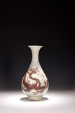 A WHITE AND RED GLAZED DRAGON VASE