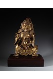 A LARGE GILT BRONZE FIGURE OF MAHAKALA WITH STAND