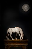 A PAINTED POTTERY FIGURE OF A HORSE