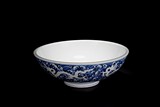 A REVERSE DECORATED BLUE & WHITE 'DRAGON' BOWL