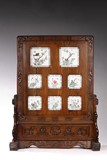 A LARGE FAMILLE ROSE PLAQUES HARDWOOD TABLE SCREEN