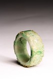 A CHINESE JADEITE CARVED BANGLE
