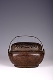 A CHINESE BRONZE HAND WARMER