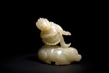 A WHITE JADE CARVING OF TIBETAN BUDDHIST DEITY