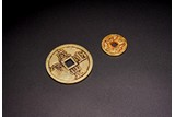 A GROUP OF TWO CHINESE GOLD COINS