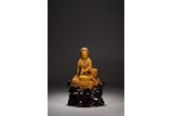 A CHINESE SOAPSTONE CARVING OF SEATED GUANYIN