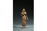A COPPER ALLOY FIGURE OF STANDING FIGURE
