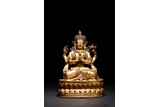 A GILT BRONZE FIGURE OF FOUR-ARMED BODHISATTVA