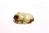 A YELLOW AND RUSSET JADE CARVING OF MYTHICAL BEAST