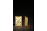 A PAIR OF WHITE JADE RETICULATED GILT BRONZE BOOKENDS