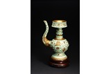 A TURQUOISE GREEN GLAZED GILT DECORATED TIBETAN STYLE EWER