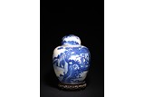 A BLUE AND WHITE 'FIGURES' JAR AND COVER 
