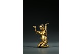 A CHINESE GILT BRONZE KNEELING FIGURE