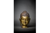 A GILT BRONZE BUDDHA HEAD