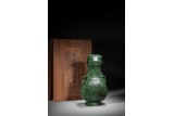 A LARGE CHINESE SPINACH GREEN JADE 'TAOTIE' HU VASE
