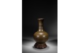 A CHINESE TEA-DUST GLAZED VASE WITH STAND