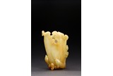 A YELLOW JADE CARVED LOTUS CUP