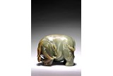 A GREEN JADE CARVING OF ELEPHANT 