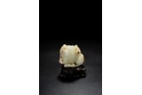 A WHITE JADE CARVING OF PEACH AND MONKEYS