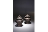 A PAIR OF CHINESE SILVER 'FLOWERS' ENGRAVED JARS AND COVERS