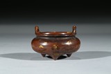 A BROWN GILT-SPLASHED GLAZED TRIPOD CENSER